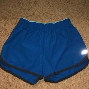 Small blue New Balance shorts.